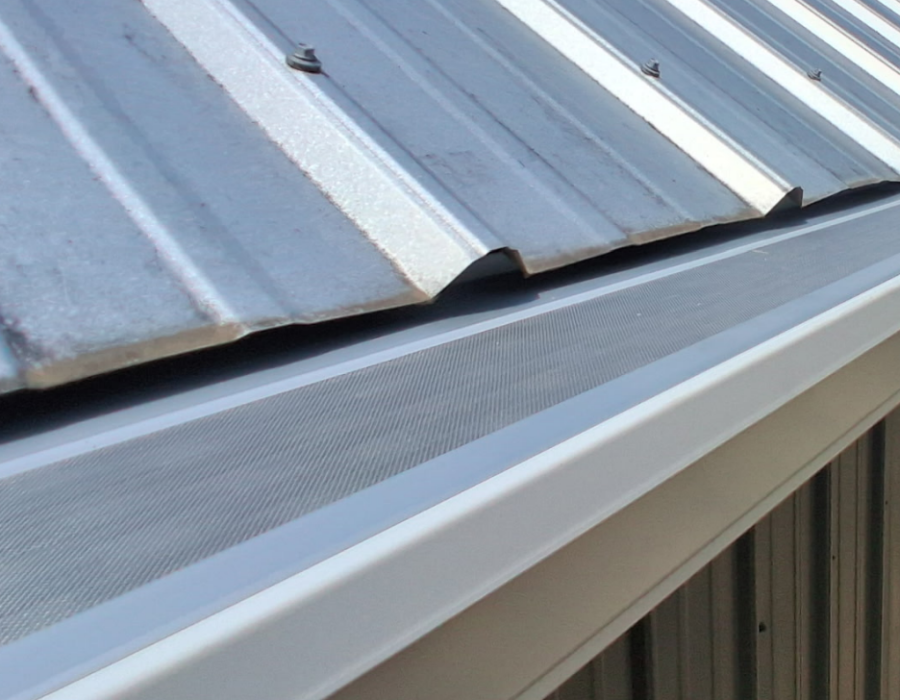 Micro-mesh gutter guard installed along a home's roof edge